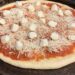 Bread Machine Pizza Dough topped with tomato sauce and fresh mozzarella