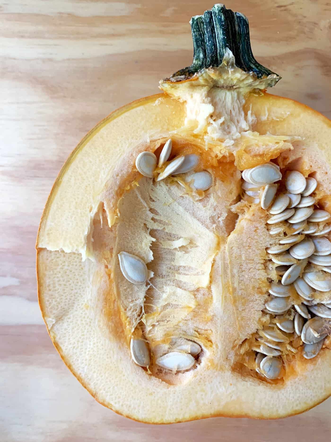 Pumpkin cut in half with seeds