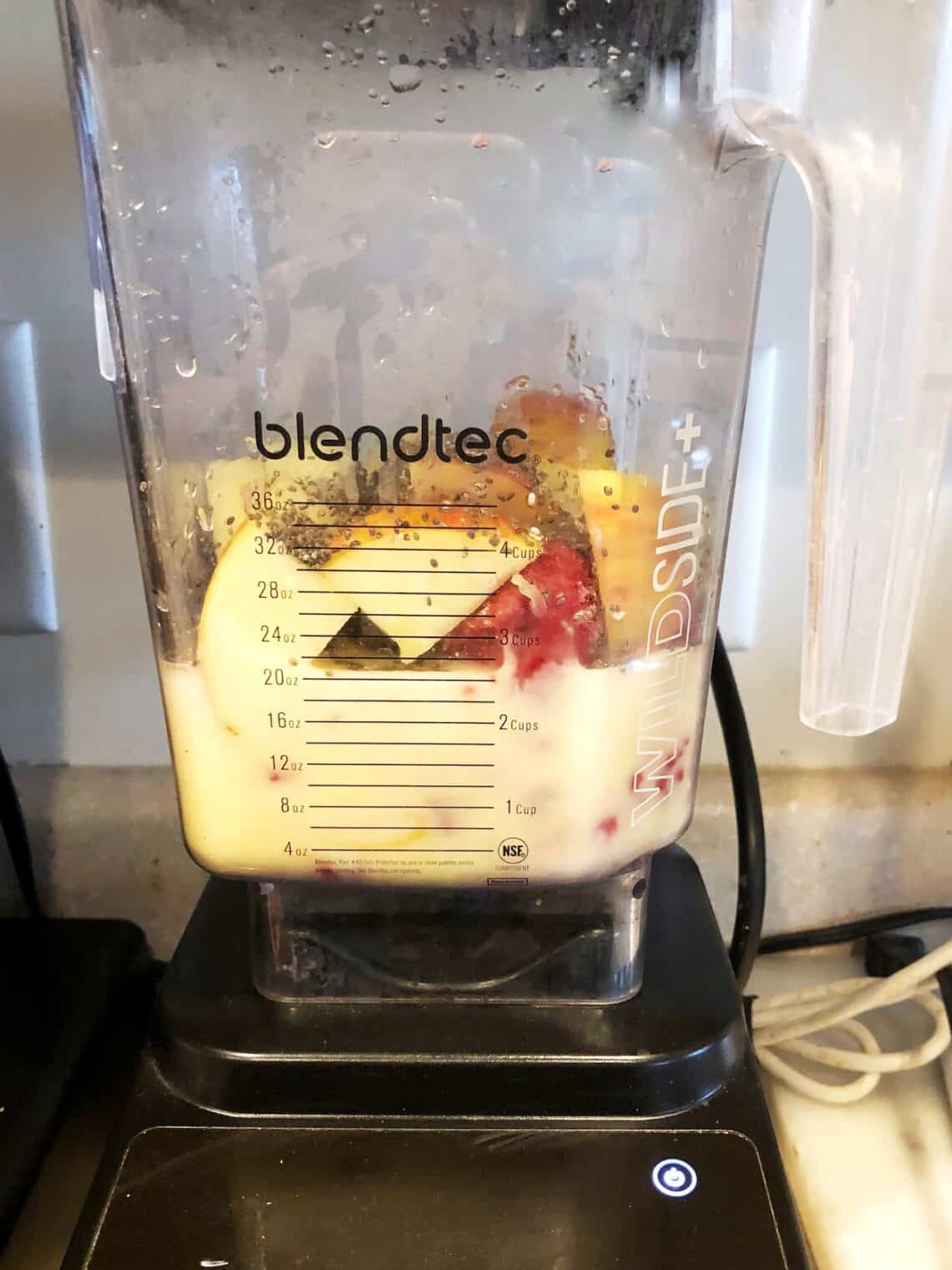 Fruit smoothie ingredients in a blender