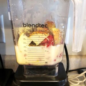 Fruit smoothie ingredients in a blender