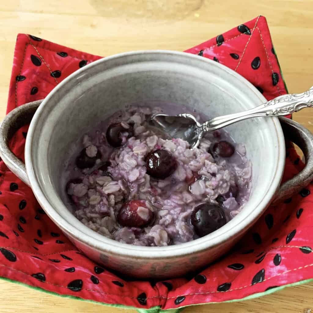 Homemade blueberry oatmeal in a cute bowl