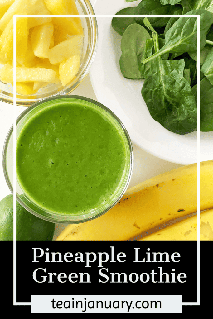 Pineapple lime green smoothie in a glass with fresh pineapple, spinach, and lime.