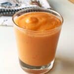 Healthy Carrot Mango-Smoothie blended and poured into a glass