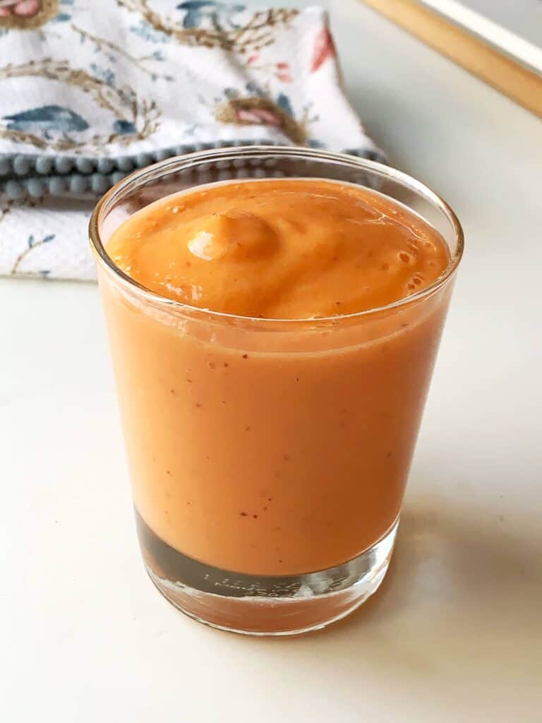 Healthy Carrot Mango-Smoothie blended and poured into a glass