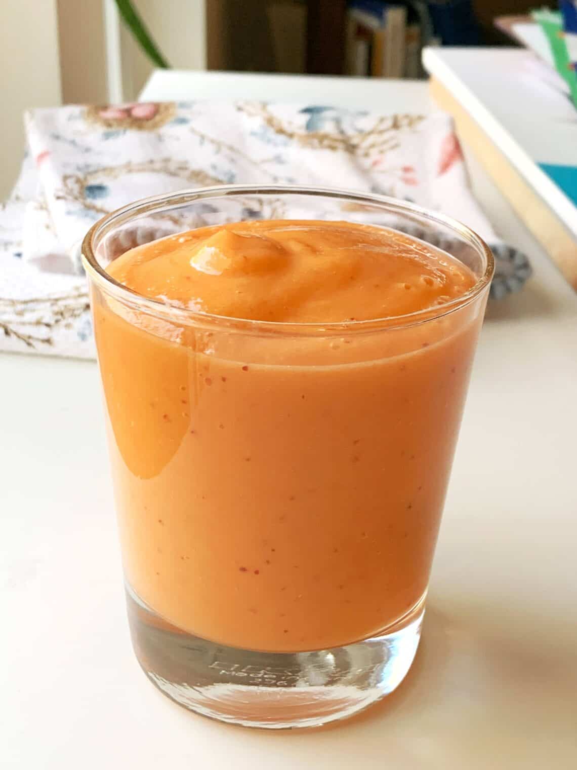 Healthy Carrot Mango-Smoothie blended and poured into a glass