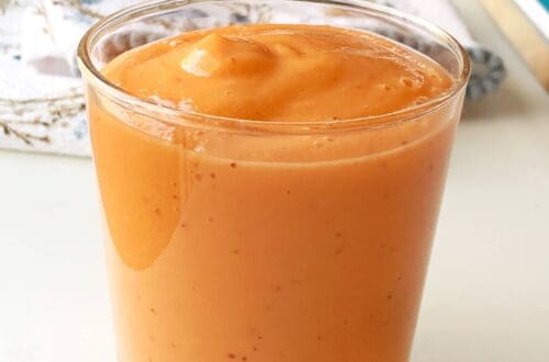 Healthy Carrot Mango-Smoothie blended and poured into a glass